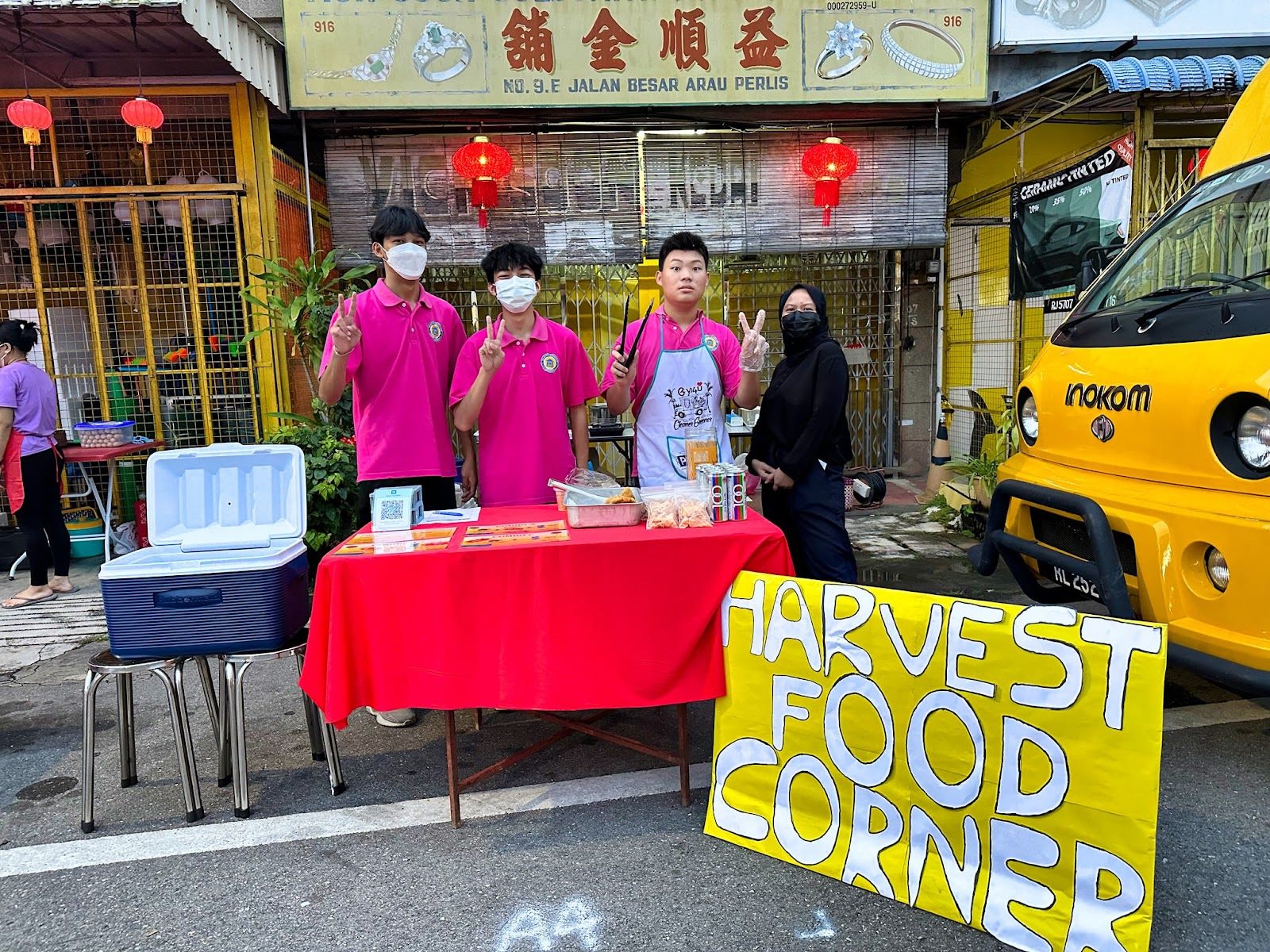 Harvest Academy students at their Harvest Food Corner booth at the Chinese New Year Carnival in Arau