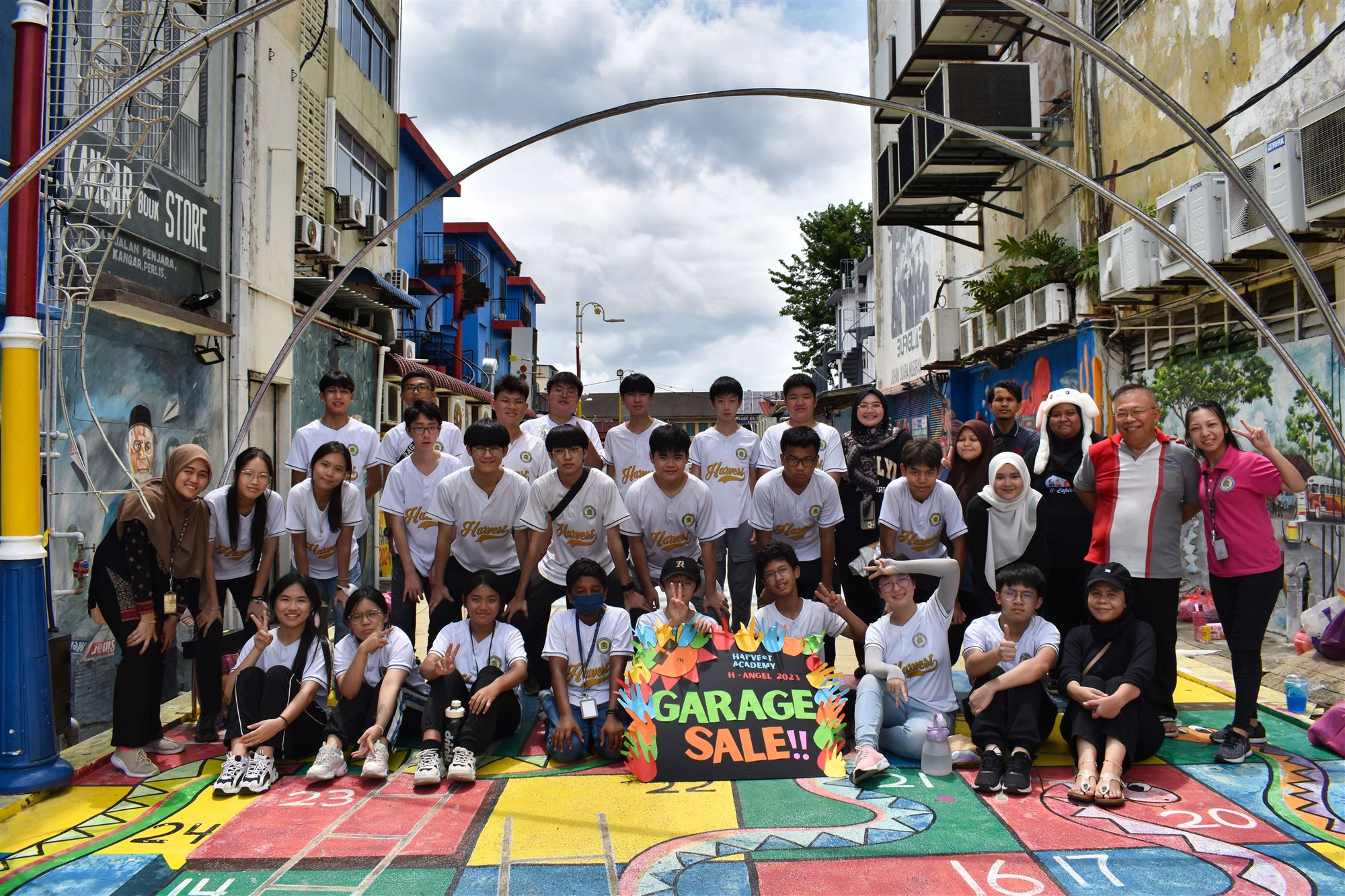 Harvest Academy students and teachers at the H-Angel Charity Garage Sale, Kangar Street Art 2.0