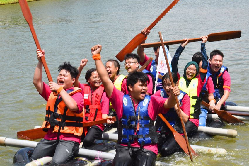 Harvest Academy students cheering on their home-made raft at H-Explore 5