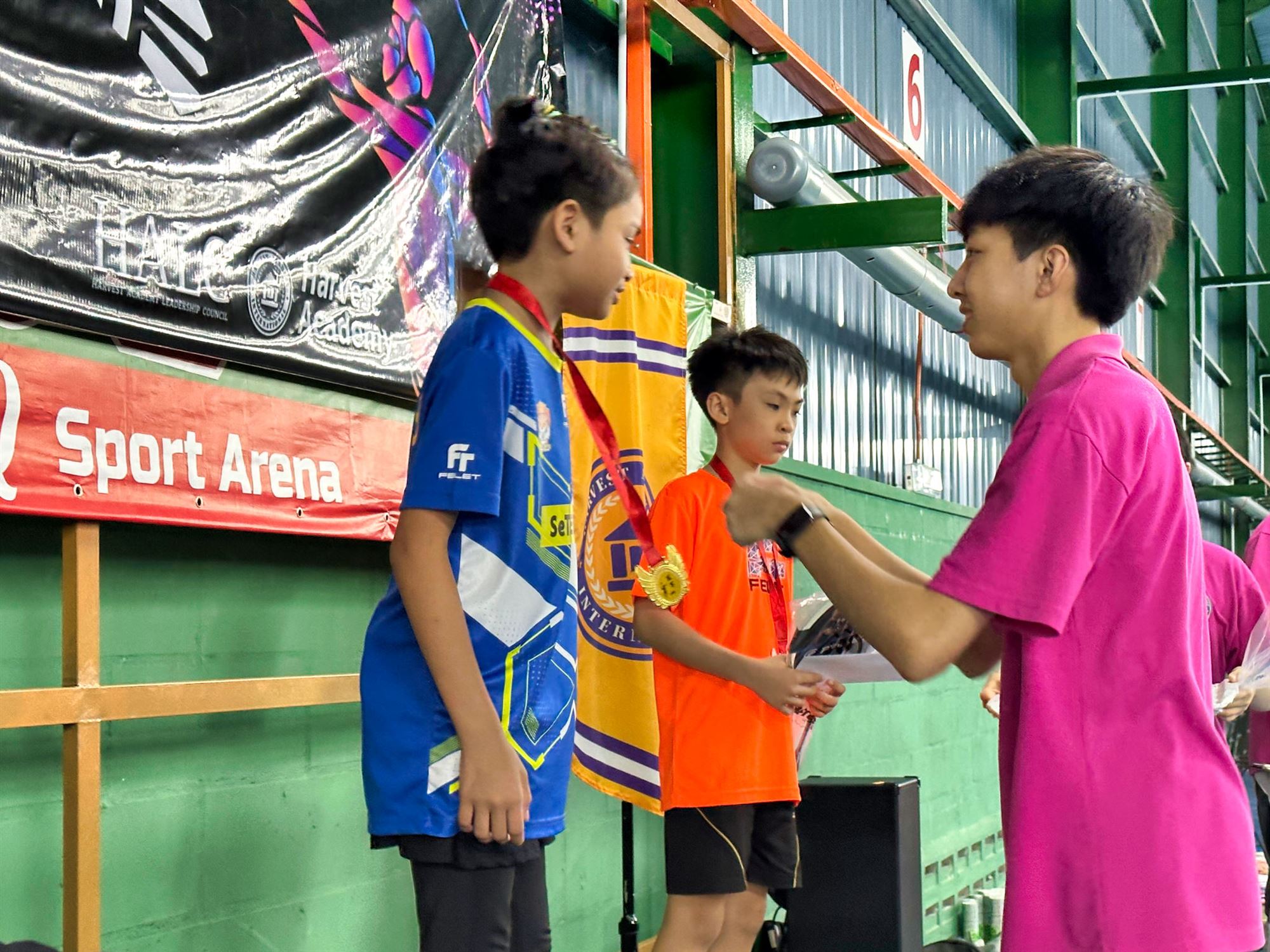 Medal presentation at the HALC Badminton Tournament